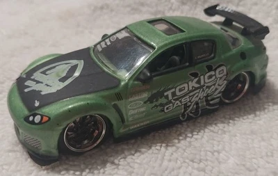 Jada Toys Import Racer #018 Mazda RX-8 Green/Black Tokico Gas Shocks 1:64 - Image 1 of 4