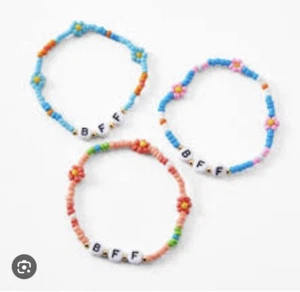 Claire’s Rainbow Coral Pink Blue Daisy Beaded BFF Bracelet Set - Picture 1 of 5