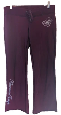 Pantalones deportivos vintage Y2K años 90 con logotipo de American Eagle para mujer talla S pierna ancha borgoña Foto 1 de 4
