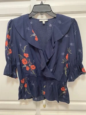 Top de trabajo con volantes estampado de flores azul marino Joie Ottoline cuello en V para mujer talla XS Foto 1 de 4