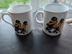 2 x Vintage Stoneware Coffee Mugs - Penguin Family in Yellow Scarves - Picture 1 of 5