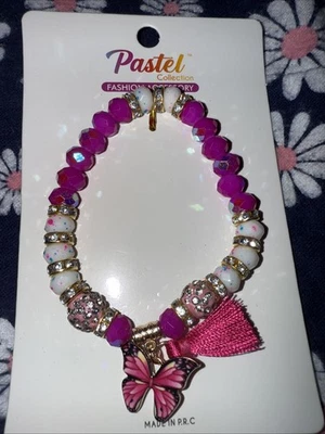 Pulsera expandible de cristal fucsia, blanco y dorado Foto 1 de 4