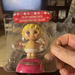 Solar Powered Dancing Cupid Blinking Eyes Dances Under Bright Lights - NEW - Picture 1 of 1