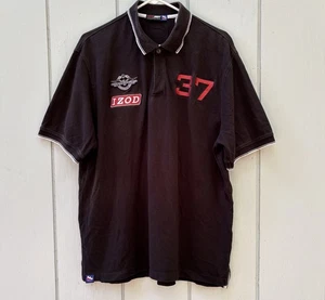 IZOD — Serie Oficial Indy Car — Polo Blanco y Negro — Hombres L — Parches — #37 — En muy buen estado - Imagen 1 de 10