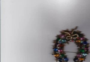 Vintage Kranz mit buntem Strass und goldener Schleife - Bild 1 von 1