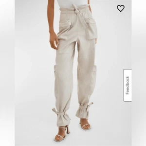 Neu mit Etikett LaMarque Braxton Kunstleder Schlupfhose mit Bindegürtel Cargo cremefarben Revolve M - Bild 1 von 13