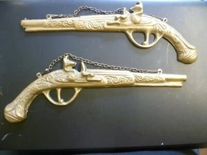 A VINTAGE PAIR OF WALL HUNG DECORATIVE CAST BRASS FLINTLOCKS. WALL FLINTLOCKS - Picture 1 of 5