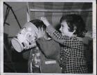 1950 Press Photo Chicago firemen rescue 2 year old with head caught in pail