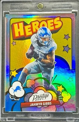 Jahmyr Gibbs RARO CÓMIC HOLO REFRACTOR TARJETA DE INVERSIÓN PANINI SSP LIONS COMO NUEVO Foto 1 de 2