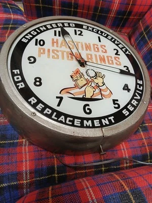 Impressive 1952 Hastings Piston Ring Glass-Faced Light-Up Service Station Clock. - Image 1 of 3