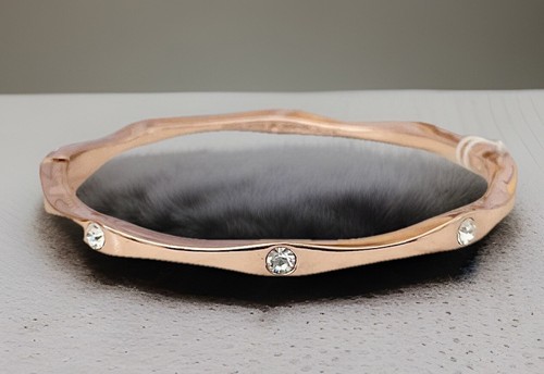 Bracciale Kate Spade onde metalli pesanti tono oro rosa nuovo con etichette