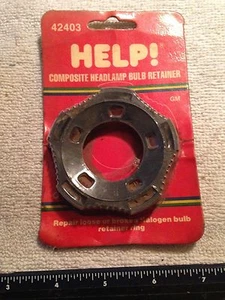 NOS HELP/MOTORMITE 42403 COMPOSITE HEADLAMP BULB RETAINER FITS OVER 2800 CARS - Picture 1 of 3