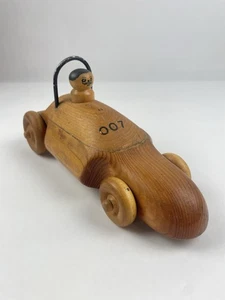 Juguete de coche de carreras de madera hecho a mano vintage - arte popular 007 conductor - juguete de empuje de madera maciza - Imagen 1 de 10