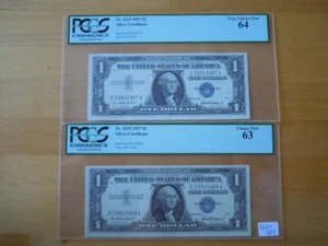 (2) 1957 $1 Consecutive Blue Seal Silver Certificates PGCS Graded 63 & 64 - Picture 1 of 5