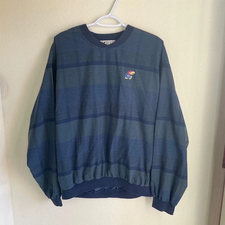 Pullover cortavientos de golf Kansas Jayhawks para hombre pequeños elementos azul y gris de colección Foto 1 de 4