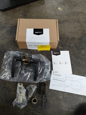 Palanca de puerta Amazon Basics Victory con cerradura, privacidad, bronce frotado con aceite Foto 1 de 4