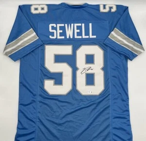 Camiseta de fútbol americano personalizada azul autografiada por Penei Sewell Beckett certificado de autenticidad - Imagen 1 de 1