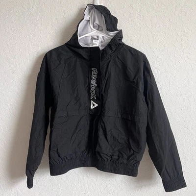 Cortavientos Reebok para niña negra activa con capucha velocidad 1/2 cremallera talla L 10/12 Foto 1 de 4
