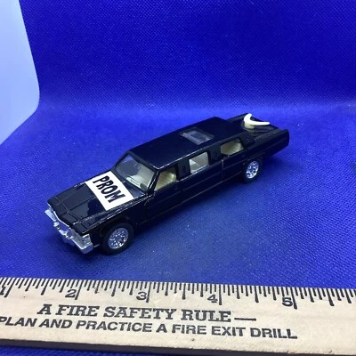 Limusina elástica Kintoy modelo diecast negra, techo corredizo retroceso funciona Foto 1 de 4