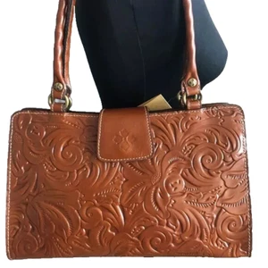 NUEVO CON ETIQUETAS**Bolso de mano Rienzo Patricia Nash de cuero bruñido* Marrón**$249**¡Encantador! - Imagen 1 de 5