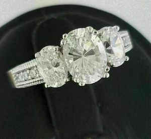 Bague de fiançailles en or blanc 14 carats et trois diamants taille ovale sim... - Bild 1 von 3