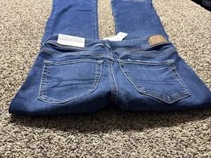 JEANS DONNA ELASTICIZZATO NUOVO CON ETICHETTE AE AMERICAN EAGLE KICK BOOT NEXT LEVEL 4 X SHORT - Foto 1 di 4