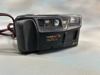 ВИНТАЖНЫЙ ПЛЕНОЧНЫЙ ФОТОАППАРАТ YASHICA T2 CARL ZEISS TESSAR 3,5/35 AF KYOCERA - Изображение 1 из 4