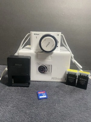 Nikon 1 J1 10.1MP Digital Camera White (Kit w/ VR 10-30mm Lens) In Box White - Image 1 of 4