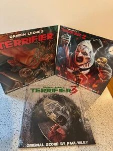 TERRIFIER 1,2,& 3 VINYL SOUNDTRACKS LIMITED EDITIONS FROM SENSORY RECORDINGS - Bild 1 von 4
