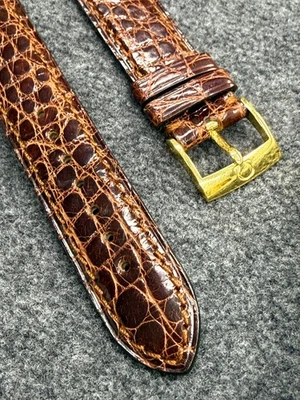 CORREA OMEGA MARRÓN 18mm con hebilla amarilla 97812064 Foto 1 de 4