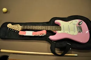 Squier (Fender) Mini Hot Pink Stratocaster Electric Guitar - Picture 1 of 14