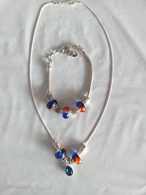 Juego de collar y pulsera de plata con cuentas de cristal azul y naranja y colgante Foto 1 de 4