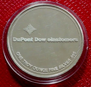 Miembro fundador DuPont DOW 1996 elastómeros redondos 1 Troy oz.999 plata en cápsula - Imagen 1 de 4