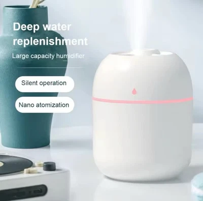 Mini humidificador de aire portátil con gota de agua Foto 1 de 4