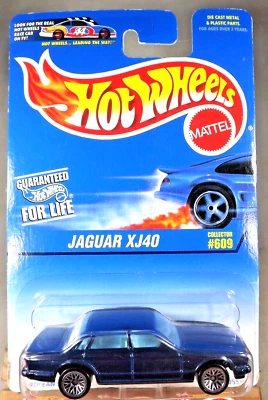 Tarjeta Hot Wheels 1996 azul/blanco #609 Jaguar XJ40 azul oscuro con radios de encaje cromado Foto 1 de 4