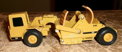 Rascador 1/64 ertl CAT 613C tiene cinturón defectuoso en buen estado usado Foto 1 de 4