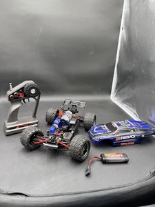 traxxas e revo con telecomando qualificatore superiore NON TESTATO NO CARICATORE  - Foto 1 di 12