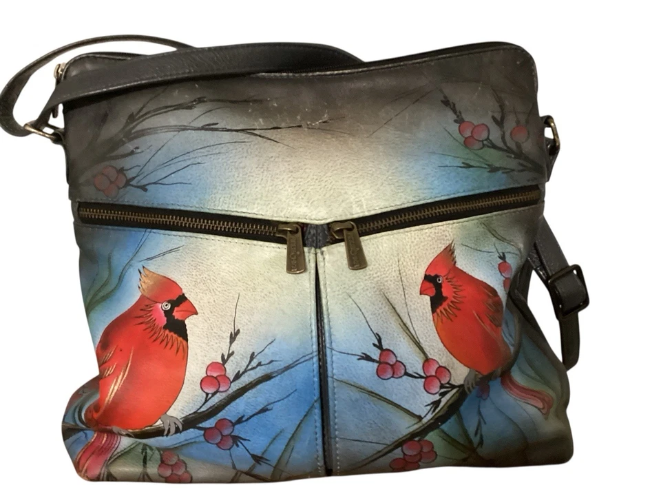 Bolso de mano cruzado para mujer Anuschka de cuero pintado a mano "Cardenal del Norte" Foto 1 de 4