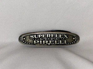 VINTAGE OLD ENGLISH NICKEL PLATED TYRE SHAPED PIRELLI SUPERFLEX PAPER KNIFE RARE - Picture 1 of 14