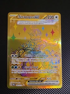 Pokémon TCG Terapagos ex 180/131 Gold Secret Rare Prismatic Evolutions - NM - Picture 1 of 2