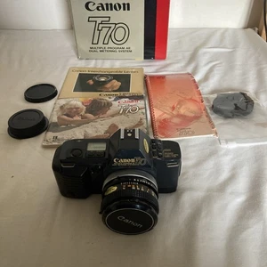 Canon T70 analoge Spiegelreflexkamera, Canon FD 50mm Objektiv verpackt mit Booklets - Bild 1 von 22