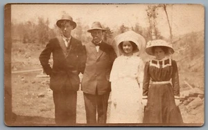Postcard RPPC c1915 Photo Of Four People All Wearing Hats - Picture 1 of 2