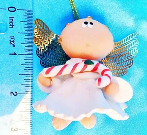 Ángel mejillas sosteniendo un bastón de caramelo adorno de Navidad - Imagen 1 de 3