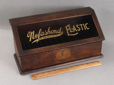 Антикварная эластичная швейная столешница 1920-х годов Nufashond стеклянная вывеска катушка футляр - Изображение 1 из 4