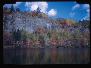 Red Boarder Colorful Autumn Foliage Reflecting on Calm Water - Picture 1 of 2