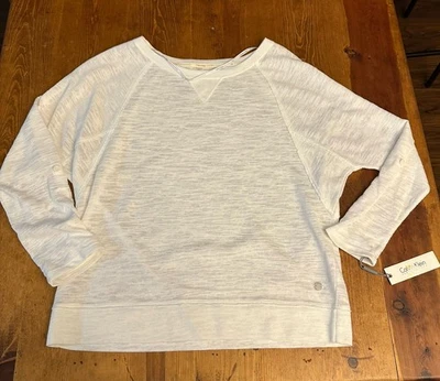 Camiseta activa Calvin Klein Performance para mujer manga raglén bandas PF6T3899 blanca Foto 1 de 4