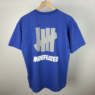 Camiseta Grande UNDEFEATED Clásica Logo Deletreado Doble Cara Azul Hecha en EE. UU. Foto 1 de 4