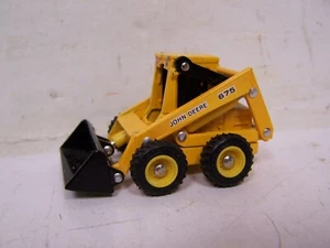 Ertl John Deere 675 Skid Loader Giallo 1/64 JD-5536-G - Foto 1 di 7