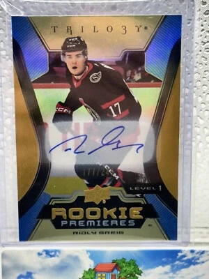 Ridly Greig 2023-24 Upper Deck Trilogy Rookie Premieres Gold Auto /249 Senators - Image 1 of 3