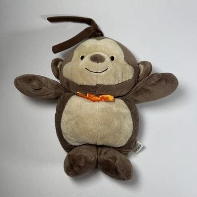 Brinquedo de berço musical Child Of Mine Carters pelúcia 9" macaco marrom laranja arco - Imagem 1 de 4